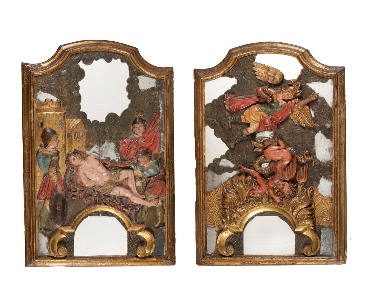 A PAIR OF SPANISH GILTWOOD FRAMED MIRRORS OVERLAID WITH CARVED RELIEFS OF ST LAWRENCE AND ST MICHAEL