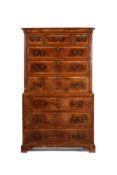 A GEORGE II BURR WALNUT AND FEATHER BANDED CHEST ON CHEST, CIRCA 1735