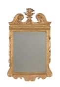 A GEORGE II GILTWOOD AND GESSO WALL MIRROR, CIRCA 1735, IN THE MANNER OF JAMES MOORE OR JOHN GUMLEY