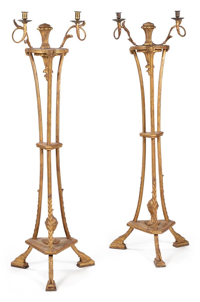 A PAIR OF GEORGE III CARVED GILTWOOD TORCHERE STANDS, CIRCA 1790