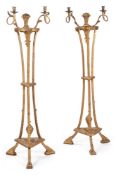 A PAIR OF GEORGE III CARVED GILTWOOD TORCHERE STANDS, CIRCA 1790