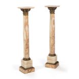 A PAIR OF FRENCH GILT METAL MOUNTED ONYX PEDESTAL COLUMNS, LATE 19TH/EARLY 20TH CENTURY