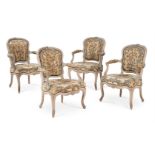 A SET OF FOUR LOUIS XV BEECH, CREAM PAINTED AND NEEDWORK UPHOLSTERED OPEN ARMCHAIRS, CIRCA 1765