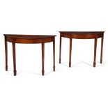 A PAIR OF GEORGE III MAHOGANY, SATINWOOD AND MARQUETRY DEMI-LUNE SIDE TABLES, CIRCA 1790