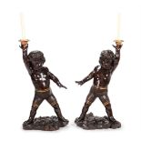 A PAIR OF CONTINENTAL CARVED WALNUT MODELS OF BOYS, 19TH CENTURY, PROBABLY ITALIAN