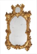 A CONTINENTAL CARVED GILTWOOD WALL MIRROR, 19TH CENTURY