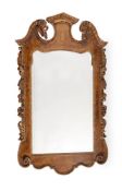 A WALNUT AND PARCEL GILT WALL MIRROR, IN GEORGE II STYLE, LATE 19TH/EARLY 20TH CENTURY