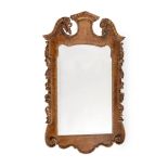 A WALNUT AND PARCEL GILT WALL MIRROR, IN GEORGE II STYLE, LATE 19TH/EARLY 20TH CENTURY