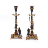 A PAIR OF FRENCH BRONZE AND PARCEL GILT CANDLESTICKS, CIRCA 1870