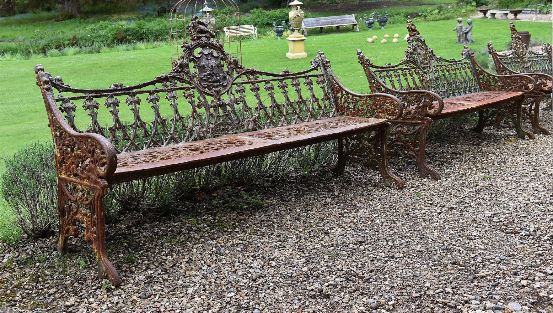 A PAIR OF CAST IRON BENCHES IN THE COALBROOKDALE 'GOTHIC' PATTERN, LATE 20TH CENTURY