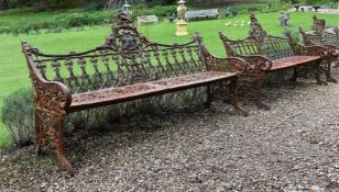 A PAIR OF CAST IRON BENCHES IN THE COALBROOKDALE 'GOTHIC' PATTERN, LATE 20TH CENTURY