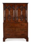 A GEORGE III MAHOGANY CLOTHES PRESS, CIRCA 1775