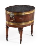 A GEORGE III MAHOGANY AND BRASS BOUND WINE COOLER, CIRCA 1800