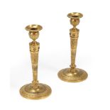 A PAIR OF FRENCH EMPIRE GILT BRONZE CANDLESTICKS, FIRST QUARTER 19TH CENTURY