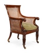 A GEORGE IV MAHOGANY BERGERE LIBRARY ARMCHAIR, CIRCA 1825, ATTRIBUTED TO GILLOWS
