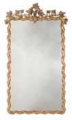 AN ITALIAN GILTWOOD AND COMPOSITION WALL MIRROR, MID 19TH CENTURY