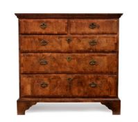 A GEORGE I WALNUT, ELM, AND FRUITWOOD CROSSBANDED CHEST OF DRAWERS, CIRCA 1720