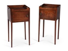 A CLOSELY MATCHED PAIR OF GEORGE III MAHOGANY BEDSIDE CUPBOARDS, CIRCA 1790