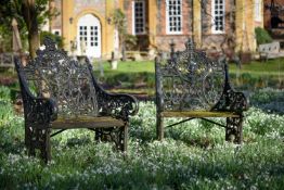 A PAIR OF BLACK PAINTED CAST IRON GARDEN SEATS, SECOND HALF 19TH CENTURY