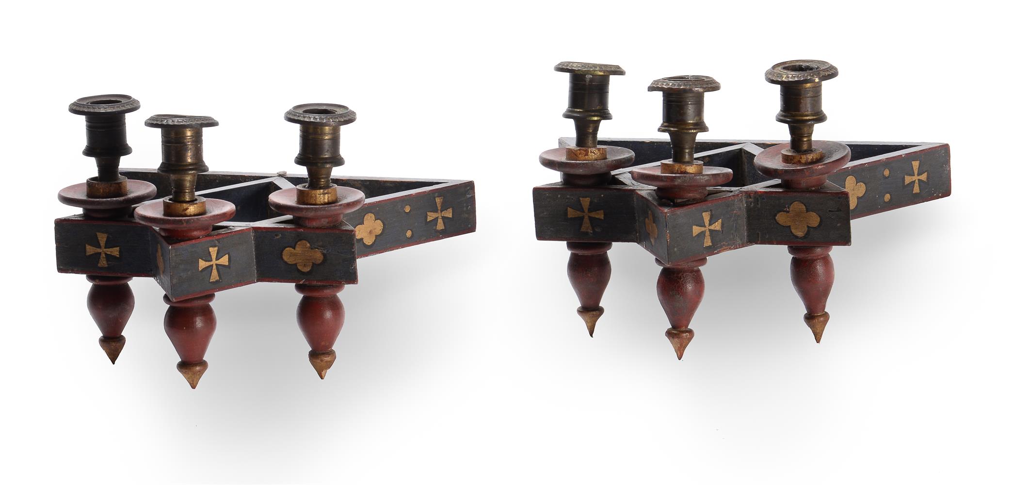 A PAIR OF POLYCHROME PAINTED THREE LIGHT WALL LIGHTS, CIRCA 1870, IN THE MANNER OF WILLIAM BURGES