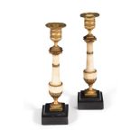 A PAIR OF GEORGE III WHITE MARBLE AND GILT METAL MOUNTED CANDLESTICKS, CIRCA 1810