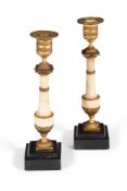 A PAIR OF GEORGE III WHITE MARBLE AND GILT METAL MOUNTED CANDLESTICKS, CIRCA 1810