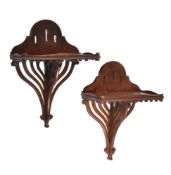 Two mahogany wall brackets of similar form