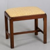 A George III and later mahogany stool