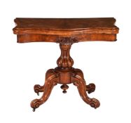 A Victorian walnut foldover card table