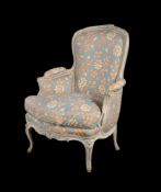 A 19th century and later French upholstered armchair