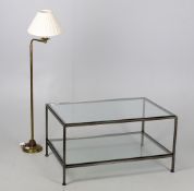 A patinated metal and glass two-tier coffee table