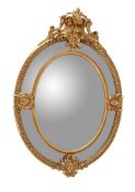 A large oval gilt mirror