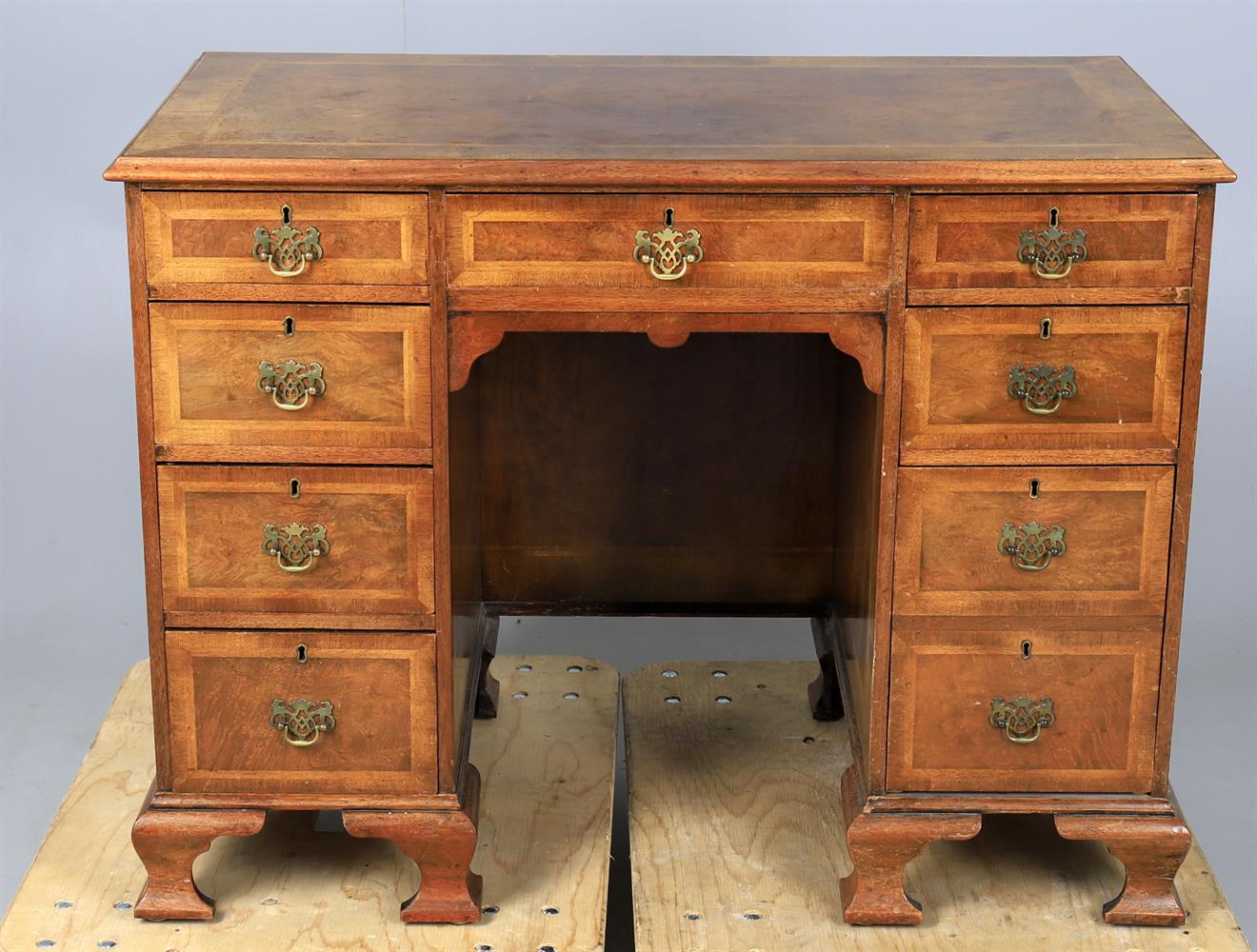 A walnut and featherbanded kneehole desk in the George II style - Image 3 of 6