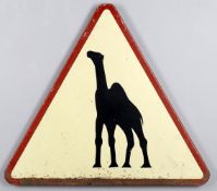 An unusual triangular road sign warning of 'camels ahead'