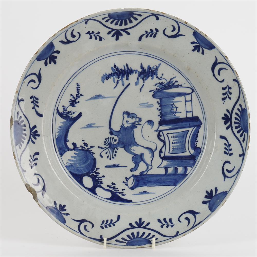 A Dutch Delft blue decorated plate of lion rampant in a landscape