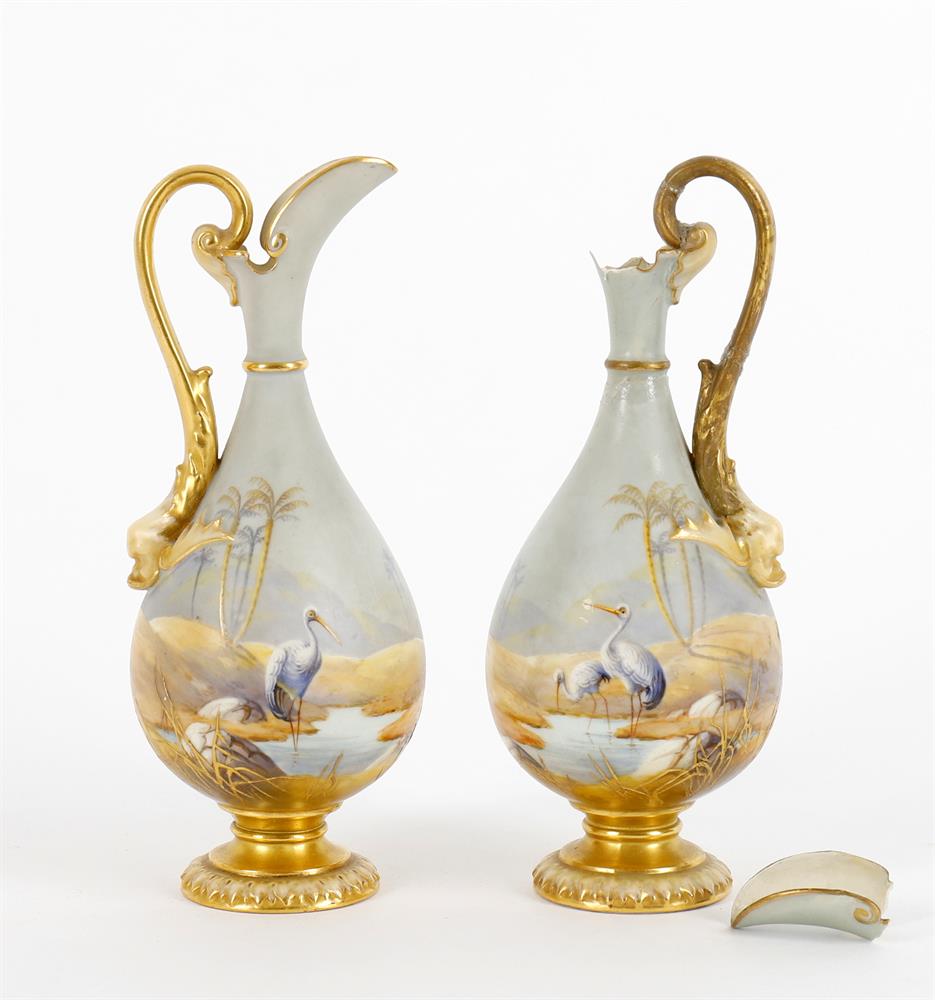 A pair of Albert Shuck for Royal Worcester small ewers