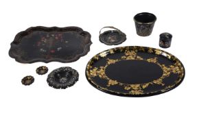 An assortment of Victorian black lacquer papier mache wares
