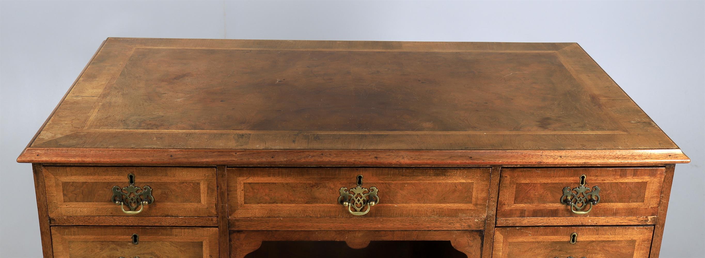 A walnut and featherbanded kneehole desk in the George II style - Image 2 of 6