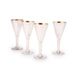 A set of four silver champagne flutes by William & Son (William Rolls Asprey)