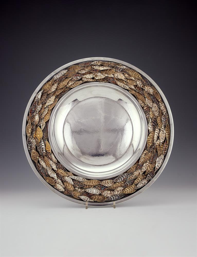 A rare large silver parcel gilt and oxidised circular charger by Stuart Devlin