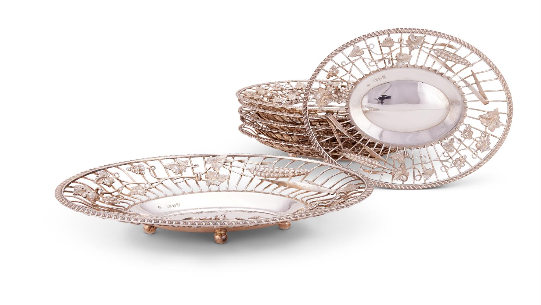 A suite of seven Victorian silver oval bread or grape baskets by Martin, Hall & Co.