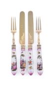 A set of eighteen Victorian silver gilt and German porcelain dessert knives and forks by Francis Hig