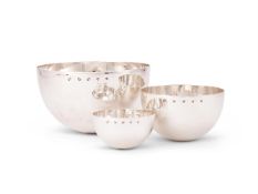 A matched set of three graduated hammered silver bowls by William & Son (William Rolls Asprey)