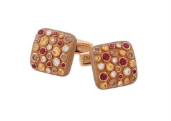 A pair of diamond, brown diamond, ruby and yellow sapphire cufflinks by William & Son
