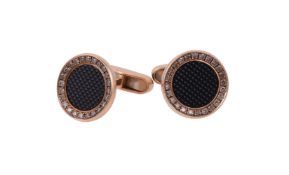 A pair of brown diamond and onyx cufflinks by William & Son