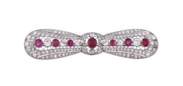 An early 20th century ruby and diamond bow brooch