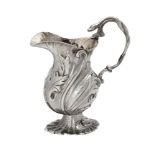 A late George II cast silver baluster cream jug by Peter Werritzer