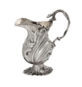 A late George II cast silver baluster cream jug by Peter Werritzer