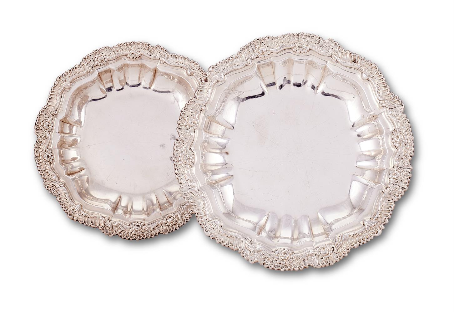 A pair of late George III silver shaped circular course dishes by Joseph Angell I