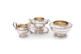 Four pieces from a silver circular pedestal tea service by James Dixon & Sons Ltd